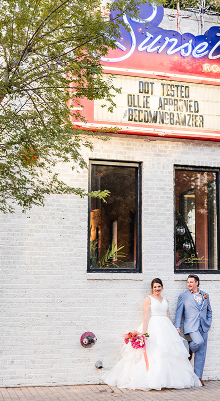 Billy and Amanda walking hand in hand outdoors